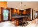 Well-appointed kitchen with granite countertops and wooden cabinets at 2409 E Cedar Ave, Denver, CO 80209