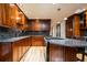 Beautiful kitchen featuring granite countertops, modern appliances, and ample cabinetry at 2409 E Cedar Ave, Denver, CO 80209