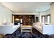 Bright living room featuring hardwood floors, fireplace, and elegant furnishings at 2409 E Cedar Ave, Denver, CO 80209