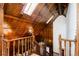 Grand staircase featuring decorative woodwork, beamed ceilings, and ample natural light at 2409 E Cedar Ave, Denver, CO 80209