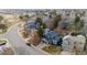 Aerial view of a neighborhood featuring well-maintained homes, mature trees, and access to community amenities at 16200 Quarry Hill Dr, Parker, CO 80134