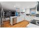 Bright kitchen with white cabinets, quartz countertops, and stainless steel appliances at 16200 Quarry Hill Dr, Parker, CO 80134