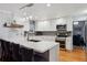 Beautiful kitchen with stainless steel appliances and a large island with bar stool seating at 16200 Quarry Hill Dr, Parker, CO 80134