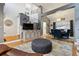 Spacious living area with staircase, hardwood floors, and adjacent dining room, creating an open concept feel at 16200 Quarry Hill Dr, Parker, CO 80134