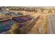 Aerial view of tennis courts surrounded by greenery and community spaces, providing recreational opportunities for residents at 16200 Quarry Hill Dr, Parker, CO 80134