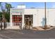Parlor Doughnuts storefront boasts a white exterior, red accents, and modern design, creating an inviting ambiance at 416 W 3Rd Ave, Denver, CO 80223