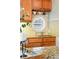 Stylish kitchen features granite counters, a porthole window, and unique display shelving above the sink at 416 W 3Rd Ave, Denver, CO 80223