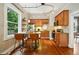 Bright kitchen features hardwood floors, stainless steel appliances, granite counters, and a breakfast bar at 416 W 3Rd Ave, Denver, CO 80223