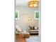 Bright and airy living room with arched floor lamp and modern furnishings at 416 W 3Rd Ave, Denver, CO 80223