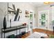 Open living room with a stylish console table and hardwood floors at 416 W 3Rd Ave, Denver, CO 80223