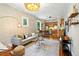 Open concept: living room flows into the modern kitchen with breakfast bar seating at 416 W 3Rd Ave, Denver, CO 80223