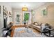 Open living room with hardwood floors, exposed brick wall, and chic decor at 416 W 3Rd Ave, Denver, CO 80223