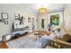 Cozy living room with wood floors, soft rug, gray sofa, and modern art at 416 W 3Rd Ave, Denver, CO 80223
