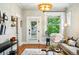 Bright living room with hardwood floors, large window, stylish furnishings, and modern lighting at 416 W 3Rd Ave, Denver, CO 80223