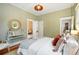 Comfortable main bedroom with hardwood floors, neutral walls, and plenty of natural light from windows at 416 W 3Rd Ave, Denver, CO 80223