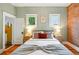 Comfortable main bedroom with hardwood floors, neutral walls, and plenty of natural light from two windows at 416 W 3Rd Ave, Denver, CO 80223