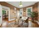 Office with hardwood floors, neutral walls, a window with a spiral staircase outside, and an open doorway at 416 W 3Rd Ave, Denver, CO 80223