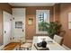 Home office with hardwood floors, neutral walls, a white table with art and books, and an open doorway at 416 W 3Rd Ave, Denver, CO 80223
