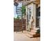 Exterior view showing spiral staircase leading to an outdoor patio with tile flooring and metal gazebo at 416 W 3Rd Ave, Denver, CO 80223
