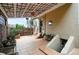 Outdoor patio featuring tile flooring, metal gazebo, spiral staircase, and seating for entertaining at 416 W 3Rd Ave, Denver, CO 80223