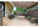 Back patio with tile flooring, a metal gazebo, and seating for entertaining guests at 416 W 3Rd Ave, Denver, CO 80223