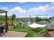 Rooftop deck featuring artificial grass, outdoor furniture, and a hammock with views of the city at 416 W 3Rd Ave, Denver, CO 80223