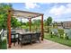 Inviting rooftop patio with pergola, fire pit, dining table and artificial turf at 416 W 3Rd Ave, Denver, CO 80223