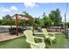 Inviting rooftop patio with pergola, fire pit, lounge seating and artificial turf at 416 W 3Rd Ave, Denver, CO 80223