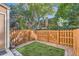 Small backyard with artificial turf and wood fence at 1342 S Idalia St, Aurora, CO 80017