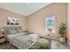 Virtually staged bedroom with a window and a plant at 1342 S Idalia St, Aurora, CO 80017