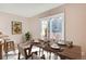 Virtually staged dining area with sliding door to patio at 1342 S Idalia St, Aurora, CO 80017