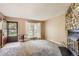 Living room with entryway and stone fireplace at 1342 S Idalia St, Aurora, CO 80017