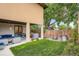 Spacious backyard with a covered patio, outdoor furniture, a lush lawn, and mature trees at 1916 S Elati St, Denver, CO 80223