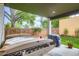 Backyard features a hot tub, patio, privacy fence, and lush greenery at 1916 S Elati St, Denver, CO 80223