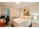 Inviting bedroom featuring soft colors, natural light, and a dedicated desk area at 1916 S Elati St, Denver, CO 80223