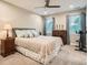 Serene bedroom featuring soft carpeting, a cozy bed, and ample natural light from the windows at 1916 S Elati St, Denver, CO 80223