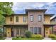 Beautiful two-story townhouse with a combination of brick and tan siding, plus a well-manicured lawn at 1916 S Elati St, Denver, CO 80223