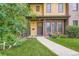 Inviting front of home featuring a well-manicured lawn and a charming walkway leading to the front door at 1916 S Elati St, Denver, CO 80223
