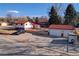 Overhead view of home with the 3 car garage, truck in drive, and nice landscaping at 3885 Hoyt St, Wheat Ridge, CO 80033