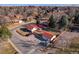 Aerial view of a home with a red tile roof and mature landscaping at 3885 Hoyt St, Wheat Ridge, CO 80033