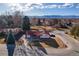 Bird's eye view of the property showing the house, 3 car garage, and landscaping at 3885 Hoyt St, Wheat Ridge, CO 80033