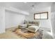 Basement area featuring a neutral color palette, plush seating, and natural light at 3885 Hoyt St, Wheat Ridge, CO 80033