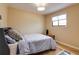 Cozy bedroom featuring natural light, wood floors, and a comfortable bed at 3885 Hoyt St, Wheat Ridge, CO 80033