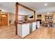 Open floor plan with a kitchen island and a clear view of the comfortable living room area at 3885 Hoyt St, Wheat Ridge, CO 80033
