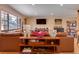 Inviting living room with a comfortable leather sofa and a view of the modern kitchen at 3885 Hoyt St, Wheat Ridge, CO 80033