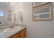 Clean bathroom featuring a vanity with a sink, a mirror, and minimalist decor at 4437 Cornish Way, Denver, CO 80239