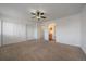 Bedroom with closet doors and adjacent bathroom at 4437 Cornish Way, Denver, CO 80239