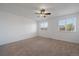 Bright bedroom with two windows and a ceiling fan at 4437 Cornish Way, Denver, CO 80239
