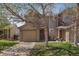 Charming two-story home featuring a two-car garage and a well-maintained front yard with mature trees at 4437 Cornish Way, Denver, CO 80239