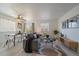 Cozy living room with a comfortable sofa, modern decor, and an adjacent dining area at 4437 Cornish Way, Denver, CO 80239